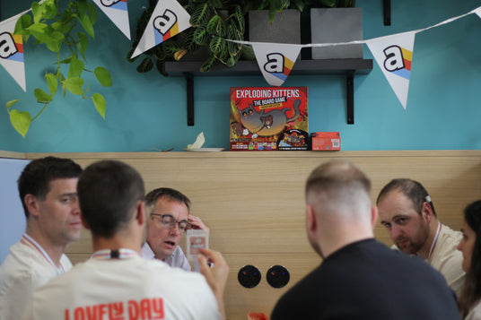 Asmodee Staff playing Exploding Kittens